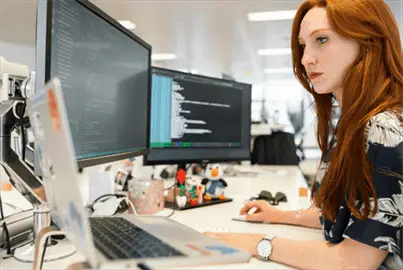 Woman Coding on Computer